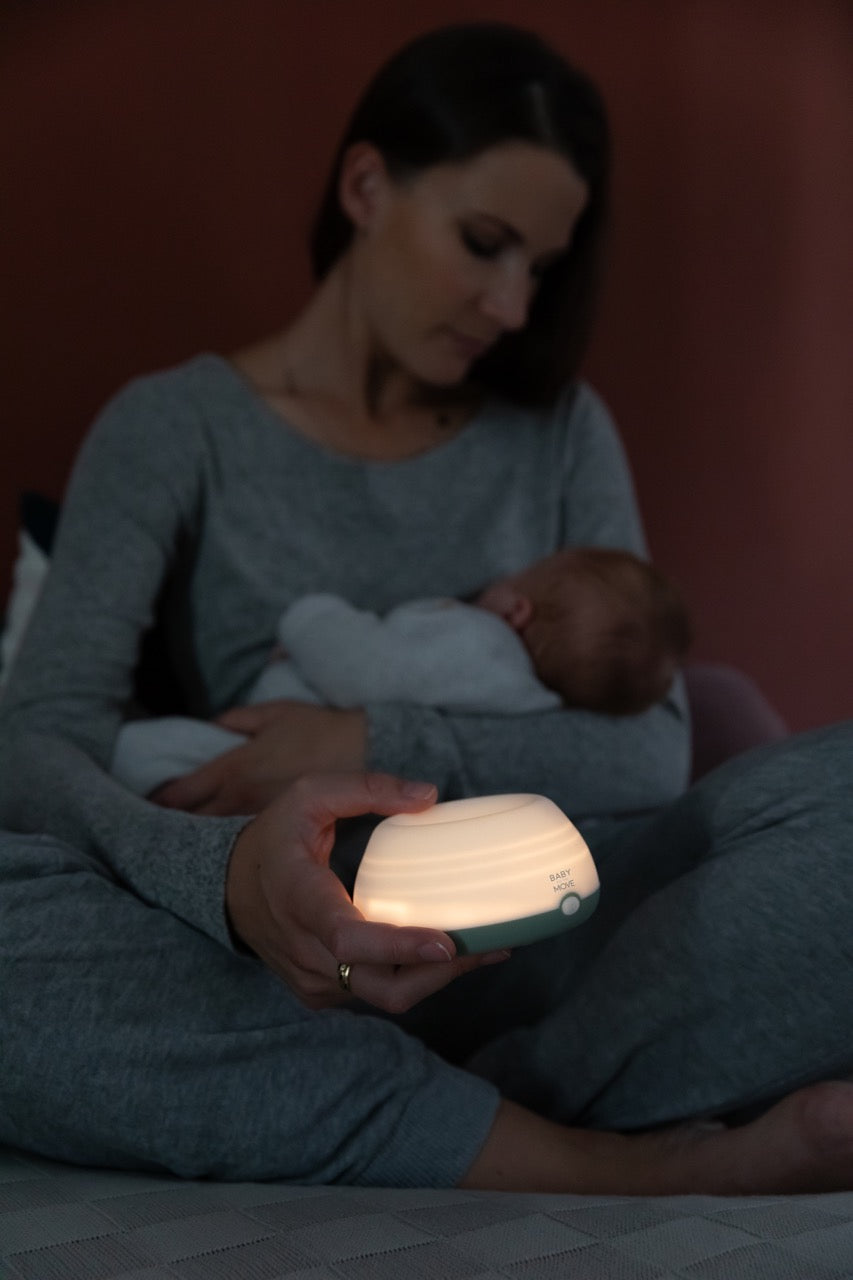 Humidifier lifestyle baby sleeping in his mom' s arms